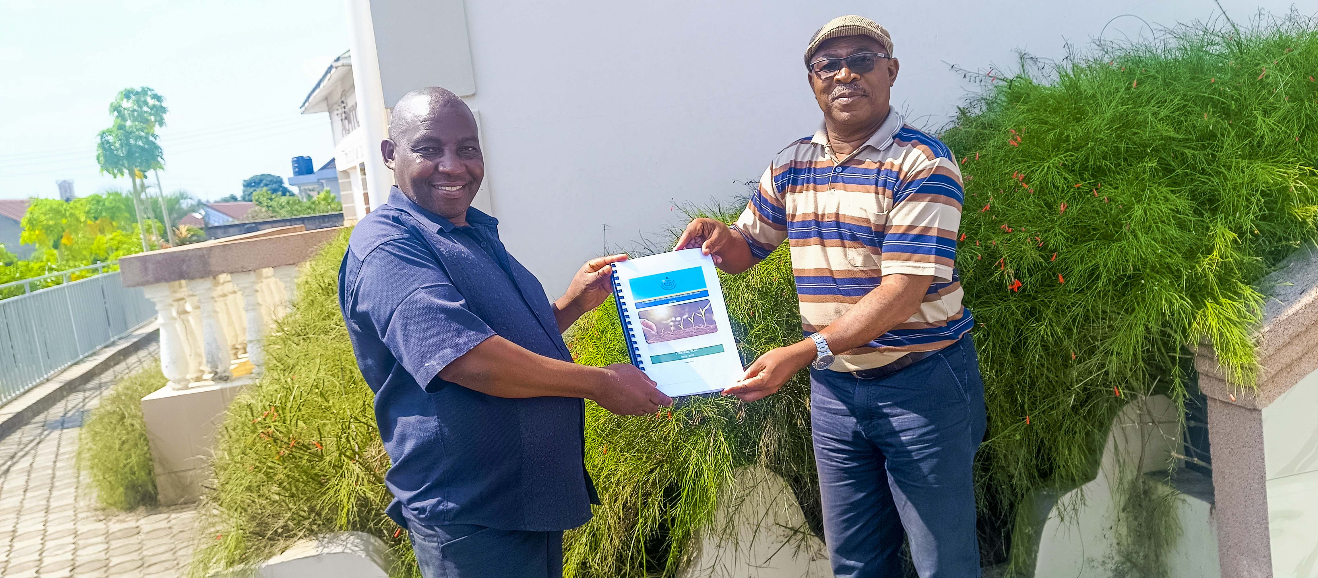 TACED celebrates CEDI’s receipt of their 2025–2028 Strategic Plan, Action Plan & Budget